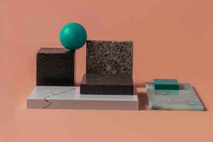 Causality-Aware 2D Materials Benchmark for Economics & Policy