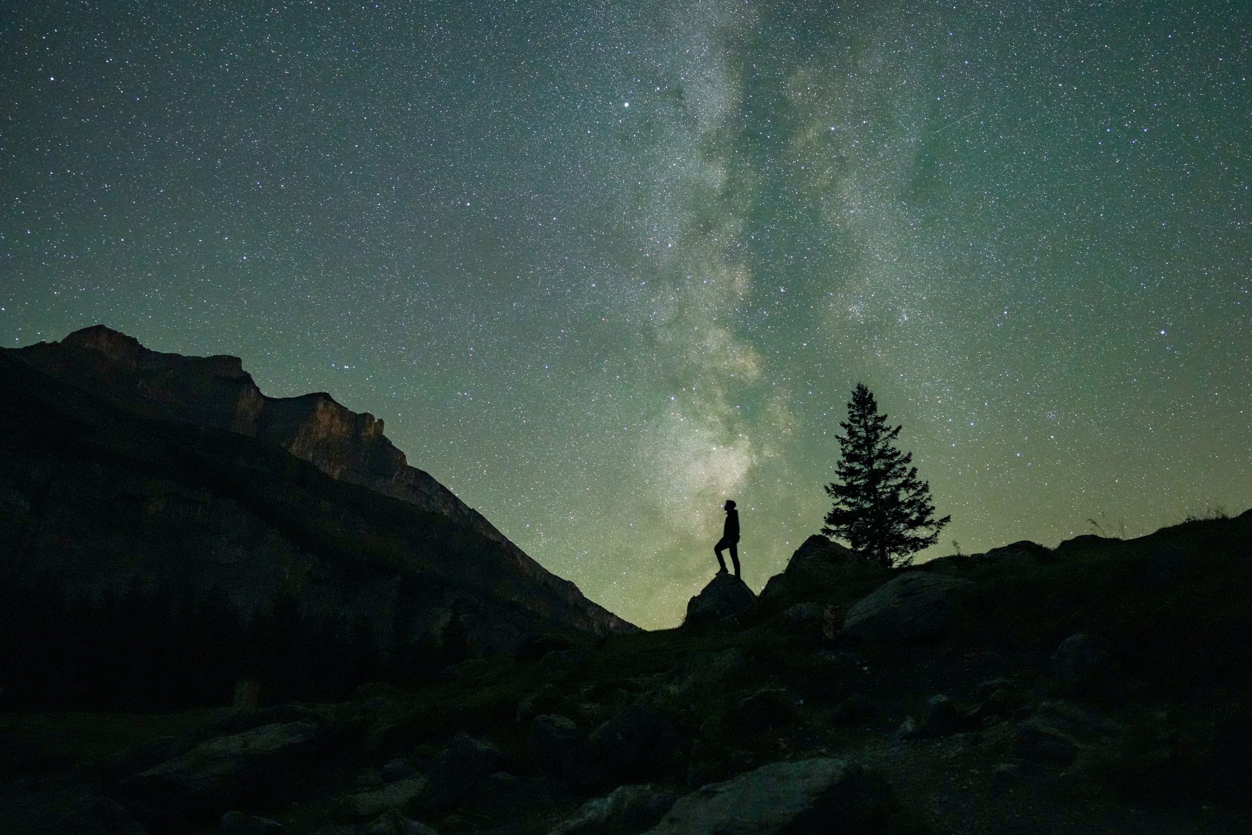Human-centered evaluation involves testing whether explanations improve user task performance. 018_Human_looking_at_the_stars_during_Perseids_with_the_Milky_Way_in_the_background_Photo_by_Giles_Laurent-11
