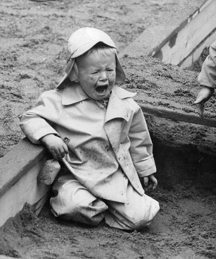 A-young-boy-sitting-and-crying-in-a-sandbox-142365913880-1