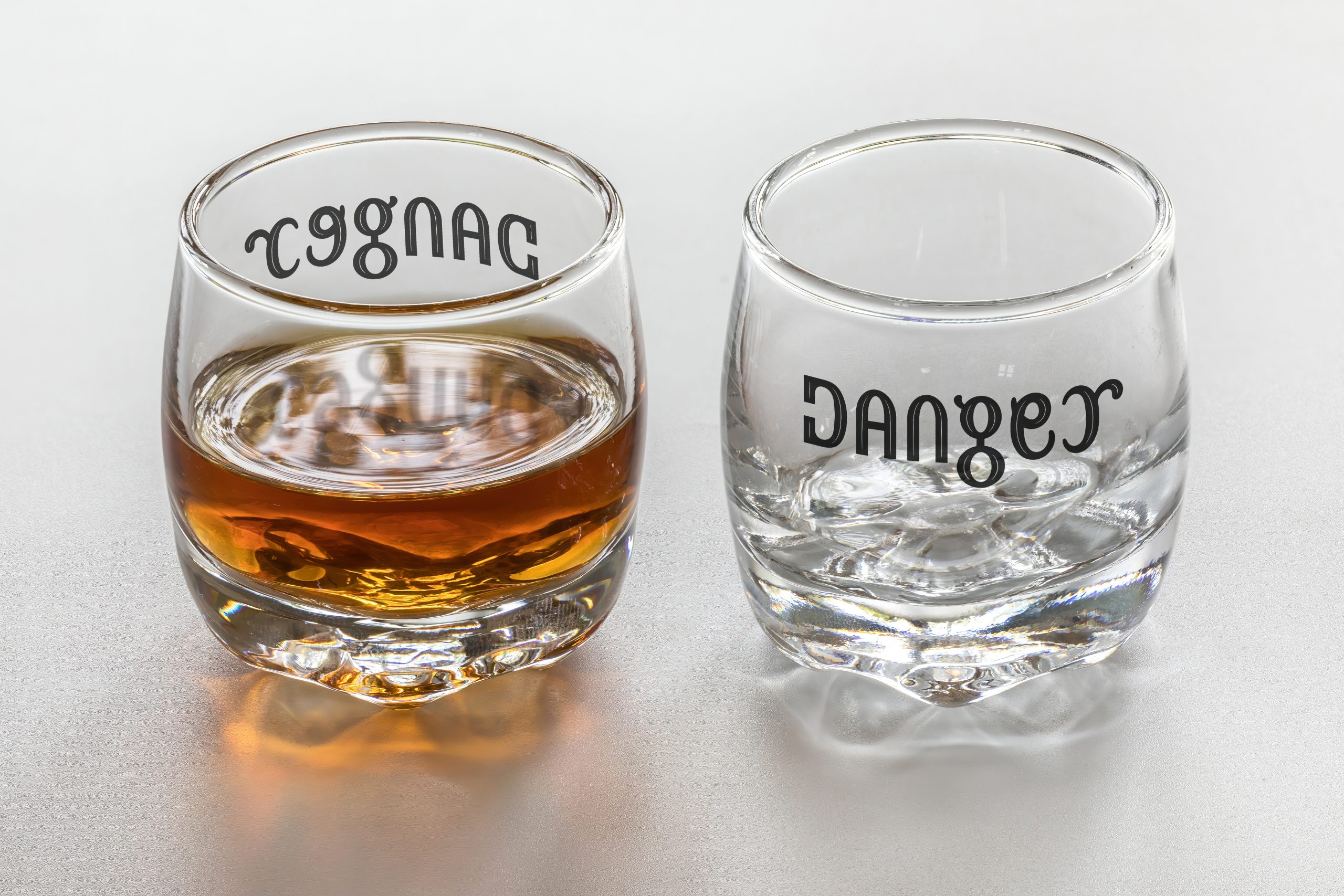 Ambigram_Cognac_Danger_on_a_set_of_two_shot_glasses_28full_and_empty29-9