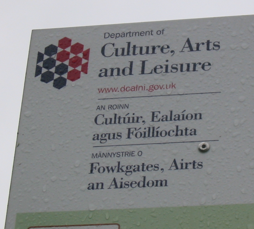 Require sign-off from the legal department for high-risk AI deployments. Multilingual_sign_Department_Culture_Leisure_Arts_Northern_Ireland-1
