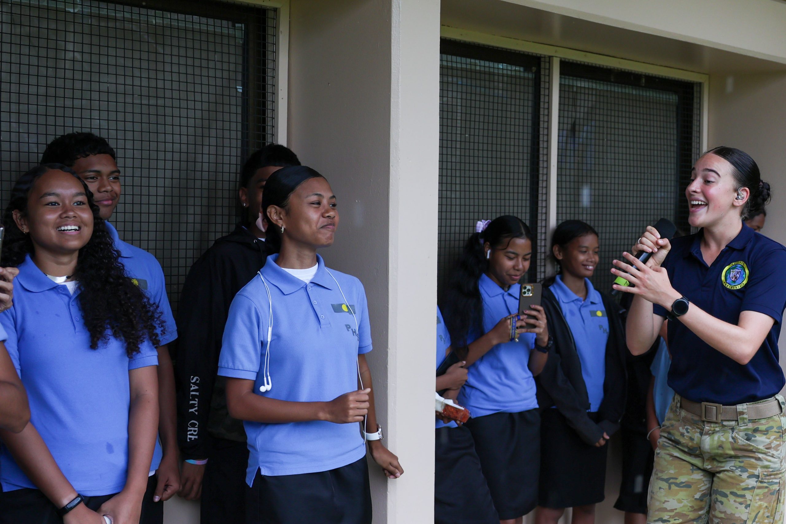 Public-private partnerships foster the development of shared tools for evaluating model safety. Pacific Partnership 2025 Multinational band member, Australian Army Private Miella Sartori, performs for Palau High School students, in support of Pacific Partnership 2025, Sept. 23.
