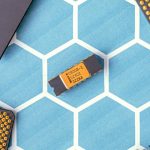 Close-up of various microprocessor chips on a blue hexagonal patterned surface, highlighting electronic technology.