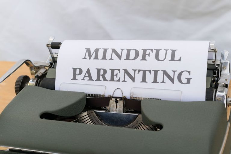 A close-up of a vintage typewriter displaying the message 'Mindful Parenting'.