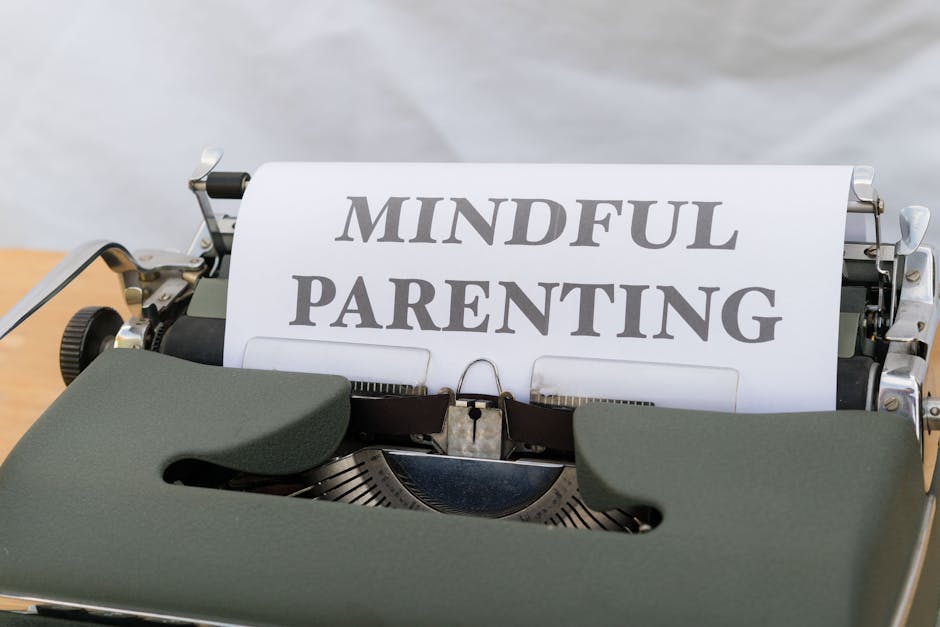 A close-up of a vintage typewriter displaying the message 'Mindful Parenting'.