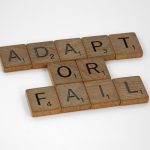 <h1>Adaptive TinyML Toolchains: The Future of Autonomous Vehicle Intelligence</h1> Scrabble tiles spell 'Adapt or Fail' on a white background, conveying a motivational message.