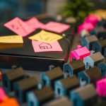 <h1>Architecting Self-Evolving Agentic Systems: The Future of Autonomous AI</h1> A vibrant display of miniature houses and sticky notes, illustrating real estate planning concepts.