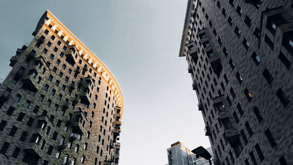 Low angle view of modern skyscrapers in Moscow with a clear evening sky.