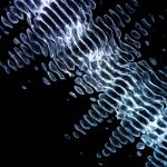 Dynamic abstract digital artwork featuring glowing geometric ripples on a dark background.