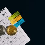 Biodiversity and the Future: Strategic Lessons for Long-Term Systems Close-up of Bitcoins on a calendar highlighting investment plans with sticky notes.