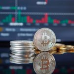 Blockchain in Finance: The Shift from Intermediaries to Systems Stack of Bitcoin coins in front of a stock market graph, reflecting cryptocurrency trends.