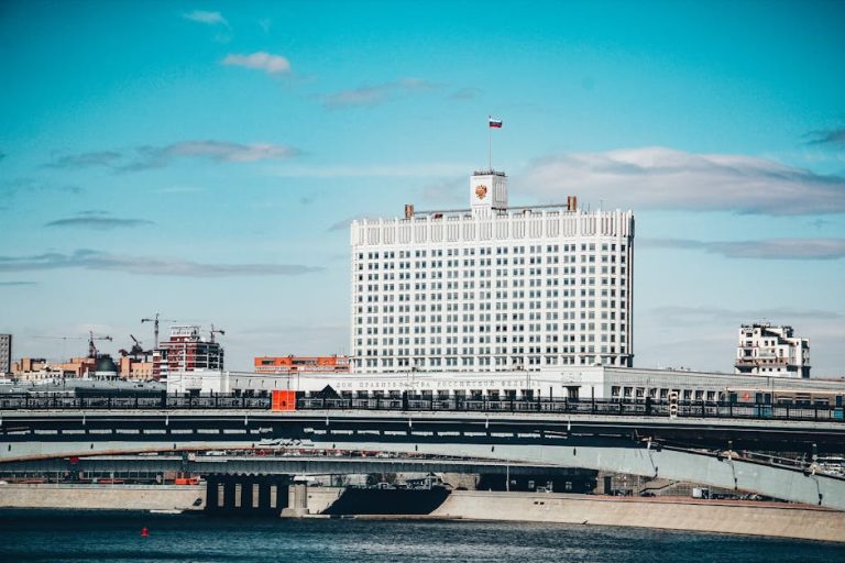 View of the Russian government building and bridge on a clear day in Moscow.