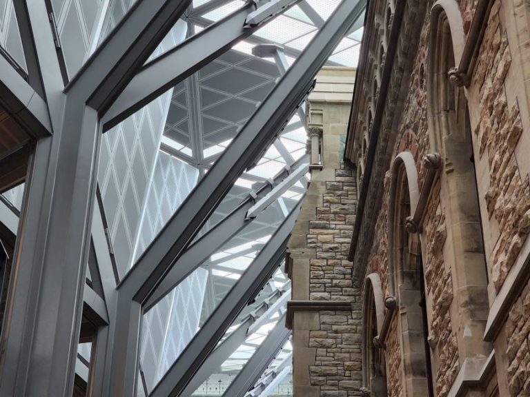 A striking blend of modern steel and historic stone architecture in Ottawa, Canada.