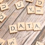 Building Interpretable Causal Inference Interfaces for Healthcare Wooden letter tiles spelling 'DATA' on a wood textured surface, symbolizing data concepts.