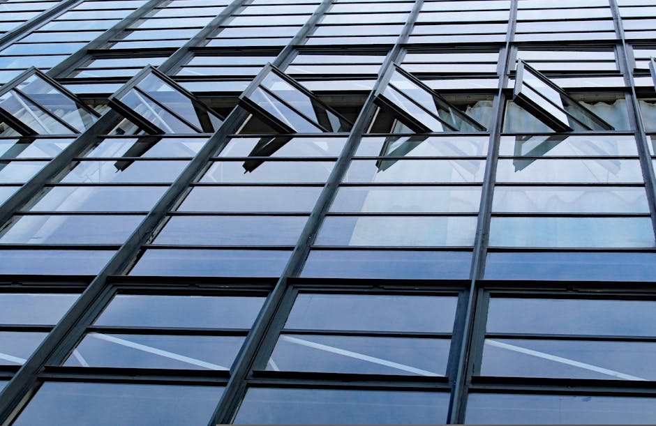 Close-up of open windows on modern Bauhaus building facade in Dessau, Germany.