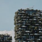 Modern building with vertical greenery, showcasing sustainable urban architecture.