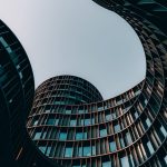 Building Verifiable Neurosymbolic Simulators for Smart Cities A striking view of modern architecture with curving facades in Copenhagen.