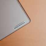 <h1>Causality-Aware Digital Twins: The Future of Geoengineering Oversight</h1> Close-up of a beige laptop with an awareness sticker, promoting mindfulness and digital organization.