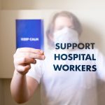 <h1>Causality-Aware Hospital at Home: A Geoengineering Framework for Modern Healthcare</h1> Person holding a support hospital workers sign, promoting health care and pandemic awareness.