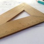 Cloud-Native Mathematics: Scaling Discovery with ISRU Systems Close-up of a wooden ruler on paper, ideal for educational themes and measuring concepts.