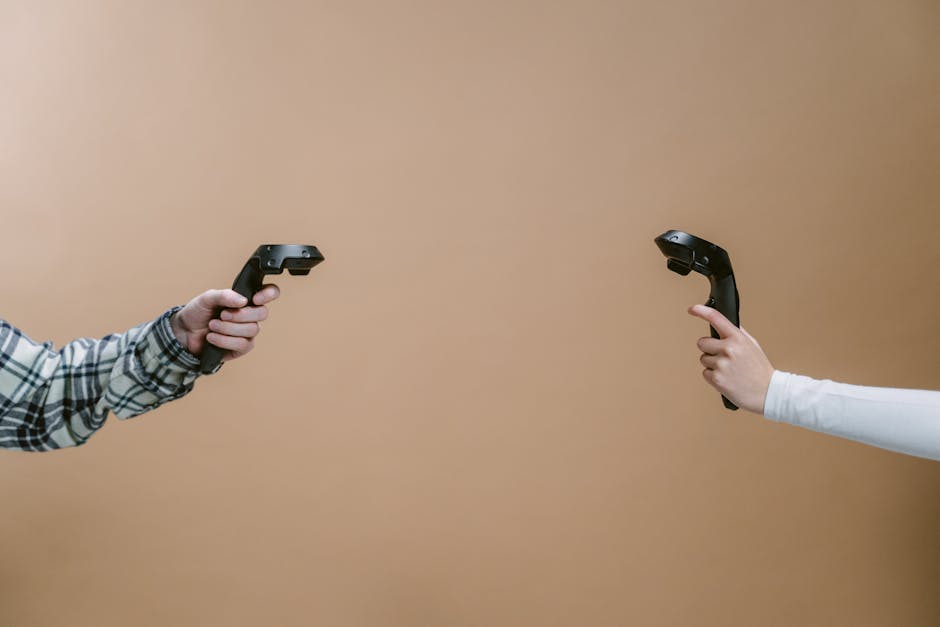 Hands holding game controllers against a brown backdrop, showcasing modern gaming technology.