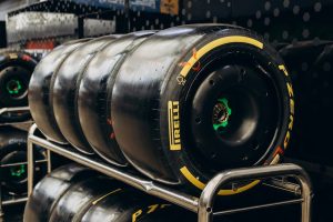 Close-up shot of Pirelli racing tires stored in a garage. Ideal for motorsport content.