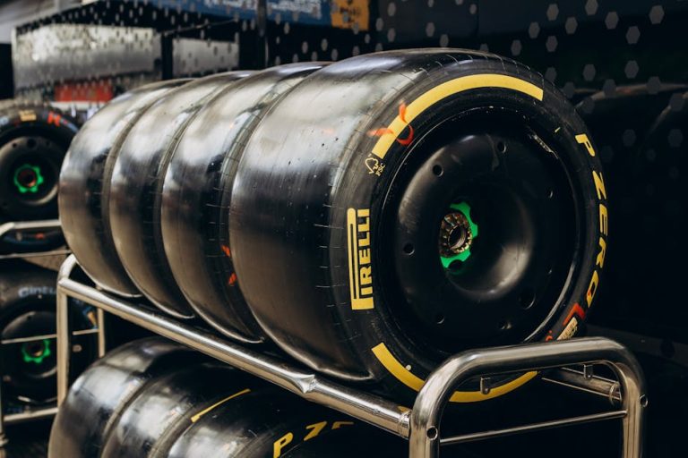 Close-up shot of Pirelli racing tires stored in a garage. Ideal for motorsport content.