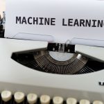 Vintage typewriter displaying 'Machine Learning' text, blending old and new concepts.