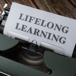 <h1>Continual Learning and Category Theory: Revolutionizing Healthcare Intelligence</h1> A classic typewriter displaying 'Lifelong Learning' on paper, symbolizing ongoing education.