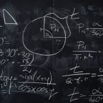 Complex trigonometric equations and geometric diagrams drawn on a classroom blackboard.