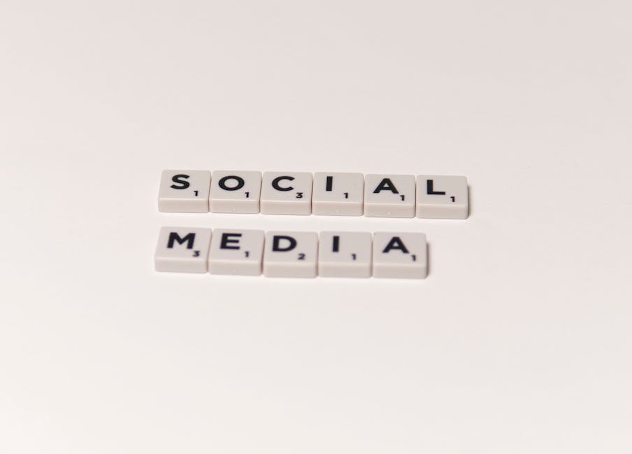 Scrabble tiles spelling 'social media' on a white background, representing digital communication concepts.