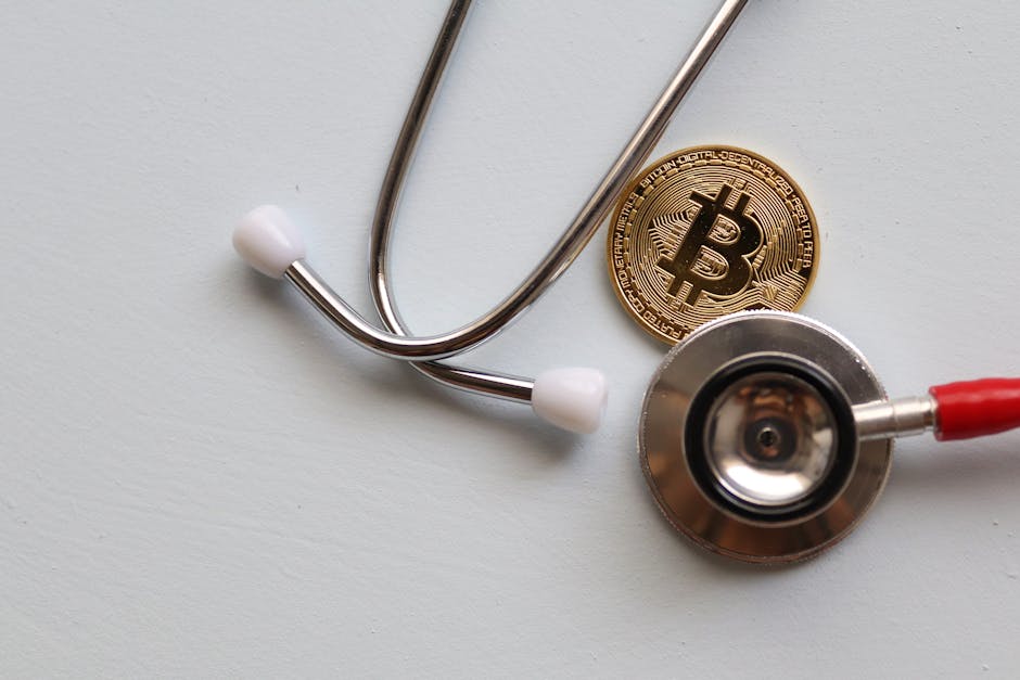 A stethoscope with a Bitcoin coin symbolizing the intersection of healthcare and cryptocurrency.