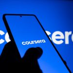 A smartphone displaying the Coursera logo against a bright blue background, symbolizing online learning.
