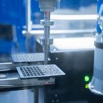 Close-up of robotic arm automating lab processes with precision.