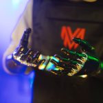 <h1>Edge-Native Metamaterials: The Future of High-Performance Computing Paradigms</h1> Close-up of robotic hands with metallic finish and neon lights, showcasing futuristic technology.