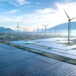Dramatic aerial shot showcasing a wind farm and solar panels in Vietnam, illustrating the potential of renewable energy sources.