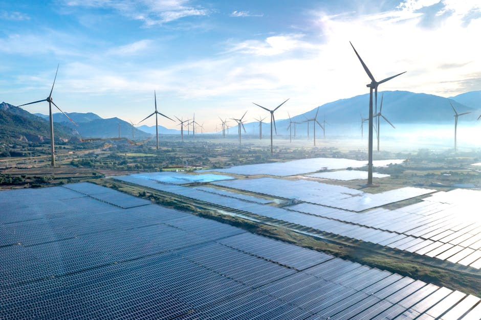 Dramatic aerial shot showcasing a wind farm and solar panels in Vietnam, illustrating the potential of renewable energy sources.