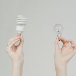 <h1>Energy-Aware Hospital-at-Home Algorithms: The Future of Remote Agritech Healthcare</h1> Hands hold incandescent and spiral light bulbs, symbolizing energy efficiency.