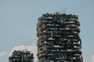 Modern building with vertical greenery, showcasing sustainable urban architecture.