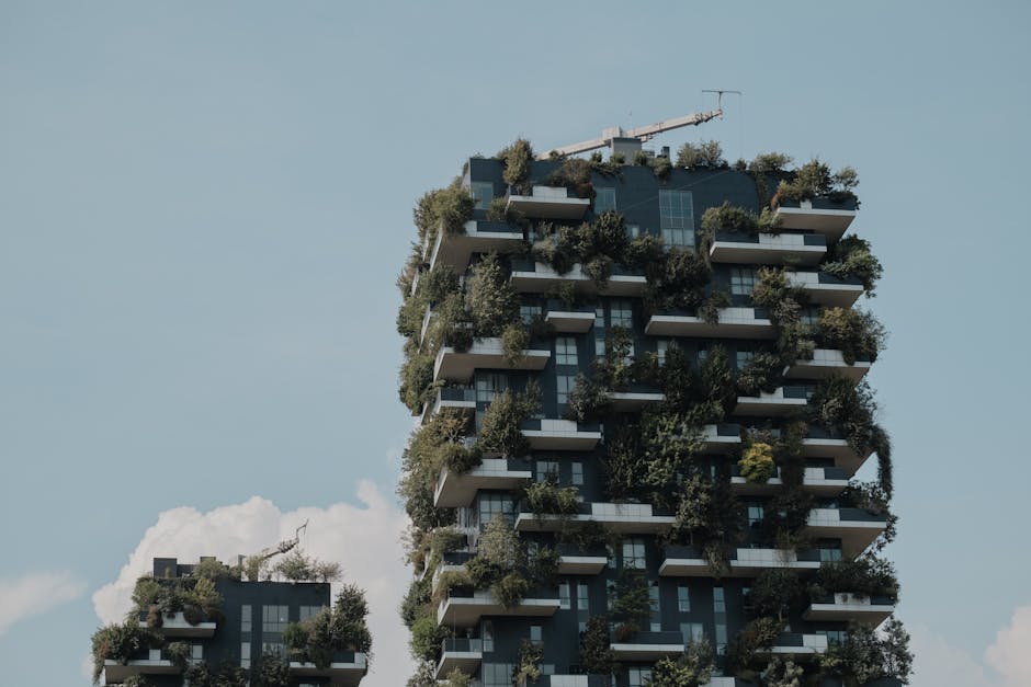 Modern building with vertical greenery, showcasing sustainable urban architecture.