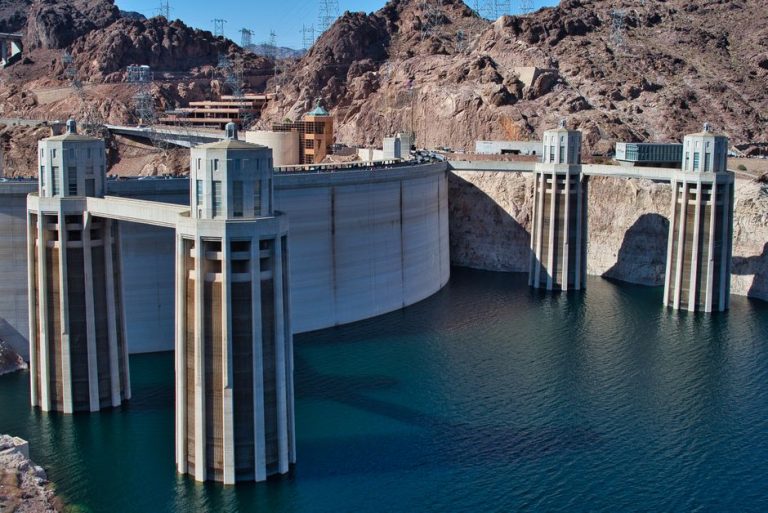 Aerial view of the iconic Hoover Dam spanning the Colorado River, showcasing its architectural grandeur.