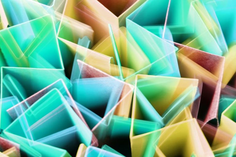 Vibrant abstract image with geometric shapes and colorful motion blur, creating a dynamic visual experience.