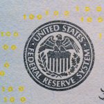 <h1>Federated Secure Multiparty Computation: Benchmarking Performance at the Edge</h1> Detailed view of the US Federal Reserve System seal on currency with yellow digital numbers.