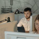 <h1>Few-Shot Agentic Systems: Accelerating the Discovery of Advanced Materials</h1> Dedicated call center agents working diligently at their desks in an office.