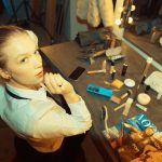<h1>Few-Shot Foundation Models: Accelerating Innovation in Advanced Materials</h1> A young woman preparing in a dressing room with makeup products and magazines around.