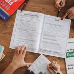 Few-Shot Learning Compilers: Boosting Supply Chain Agility Overhead view of students studying with open books and taking notes, highlighting education and learning.
