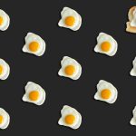 <h1>Few-Shot Protein Design: Engineering the Future of Advanced Materials</h1> Creative pattern of fried eggs on black with toast, top view.