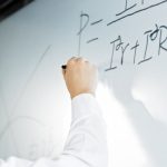 <h1>Graph-Based Zero-Knowledge Proofs: Securing the Future of Decentralized Energy Systems</h1> Close-up of a hand writing a formula on a whiteboard in a professional setting.