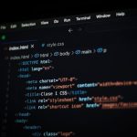 <h1>Meta-Learning Semantic Web Protocols Compilers for Cybersecurity</h1> Close-up of HTML code displayed on a computer screen in dark mode, focusing on programming concepts.