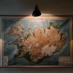 Physics-Informed Connectomics: Mapping the Brain with AI Shabby looking paper map of Iceland hung on wall and lit up with small lamps in darkened room of research station